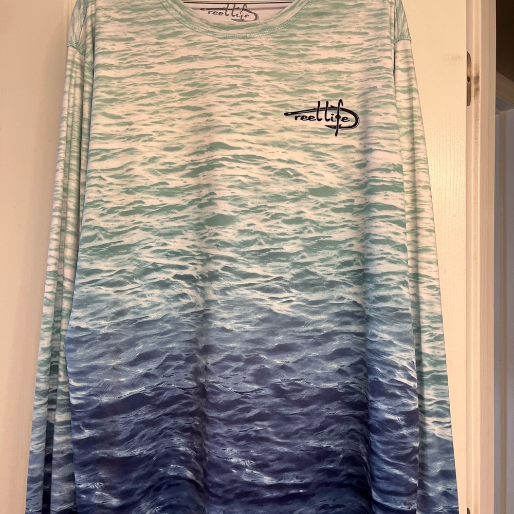 7 XXL long sleeve sport shirts and 2 matching swim trunks